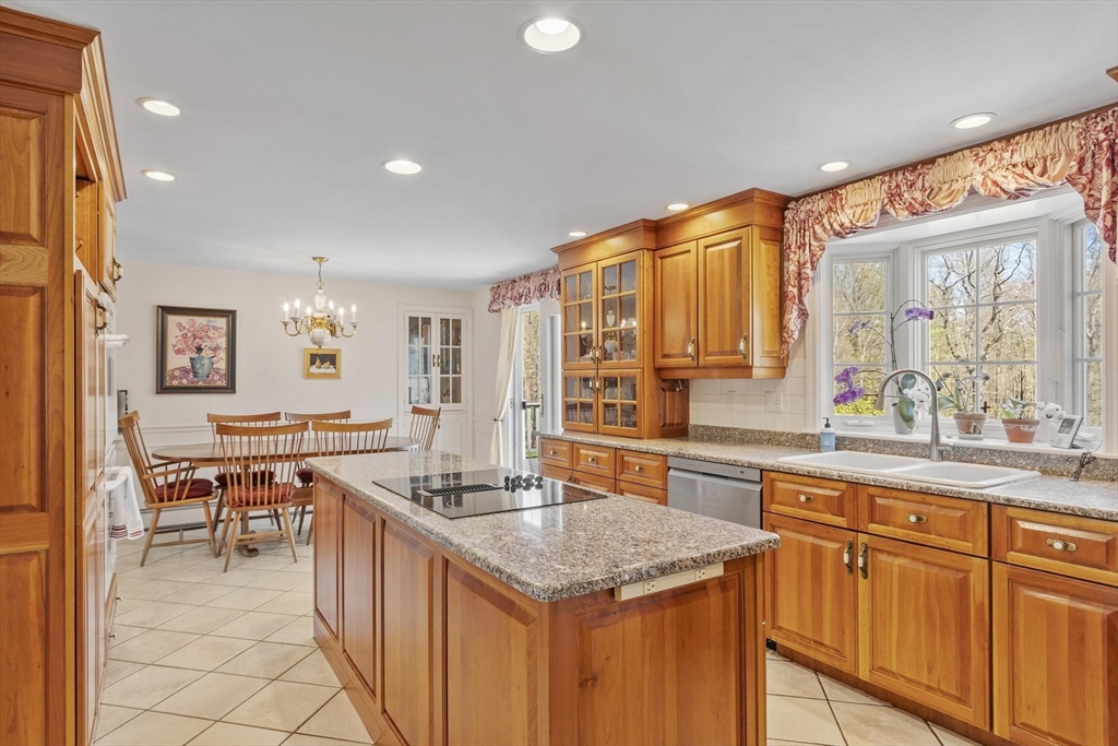 103 Brooks Station Road Princeton, MA 01541 - Photo 13 of 42 a kitchen with stainless steel appliances granite countertop a sink and a refrigerator