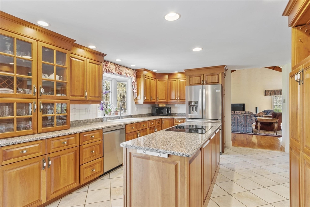 103 Brooks Station Road Princeton, MA 01541 - Photo 15 of 42 a kitchen with stainless steel appliances granite countertop a stove a sink and a refrigerator