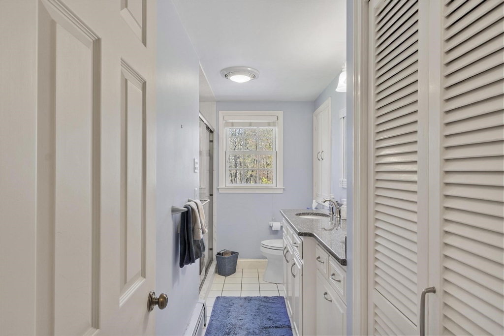 103 Brooks Station Road Princeton, MA 01541 - Photo 22 of 42 a bathroom with a sink a mirror and a shower