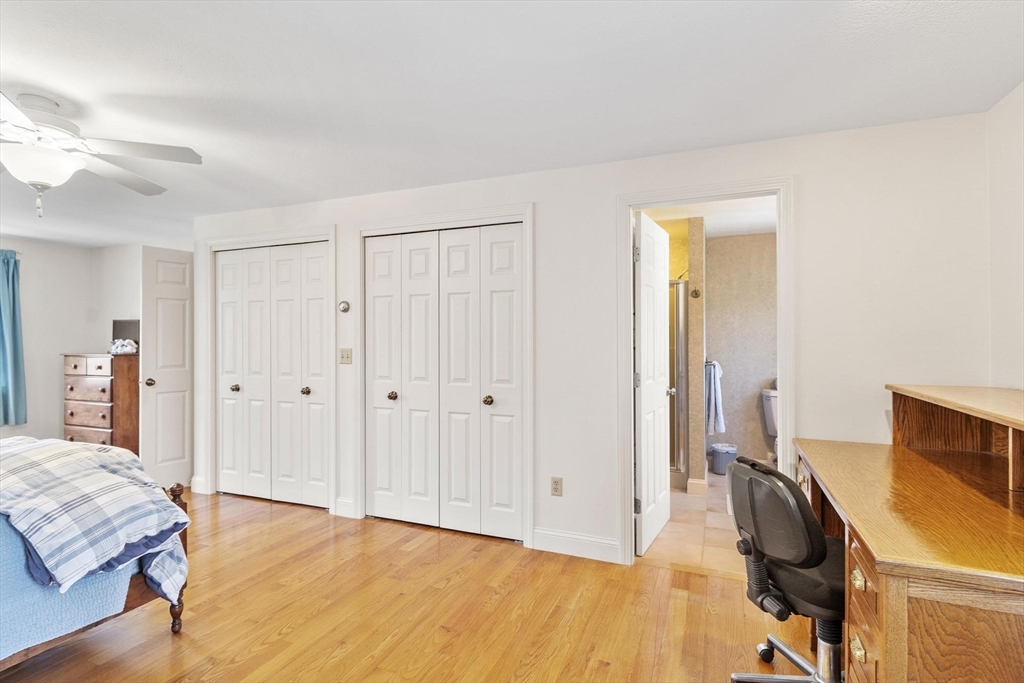 103 Brooks Station Road Princeton, MA 01541 - Photo 31 of 42 a bedroom with a bed and wooden floor
