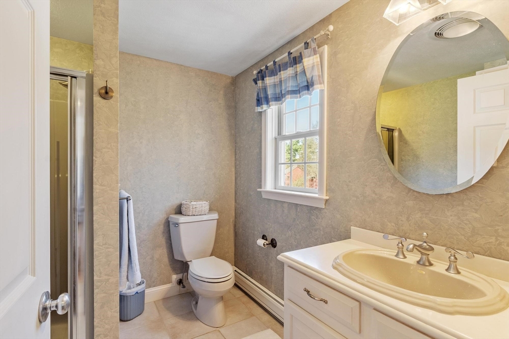 103 Brooks Station Road Princeton, MA 01541 - Photo 32 of 42 a bathroom with a toilet a sink and a mirror