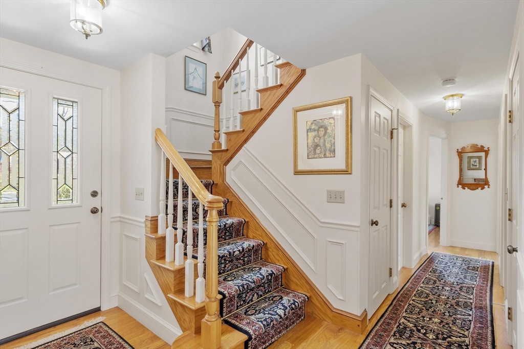 103 Brooks Station Road Princeton, MA 01541 - Photo 7 of 42 a view of staircase with wooden floor and a rug