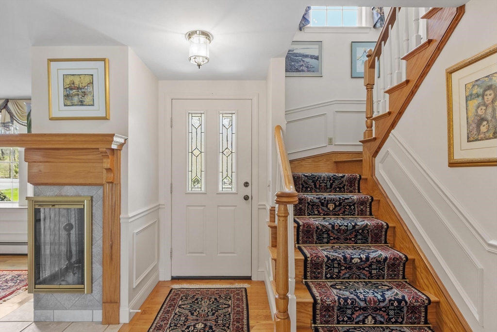 103 Brooks Station Road Princeton, MA 01541 - Photo 8 of 42 a view of a hallway with wooden floor and staircase
