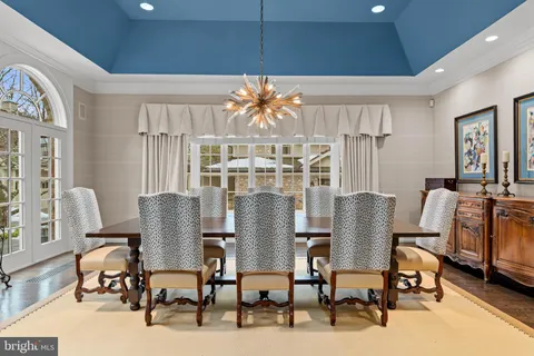 a very nice looking dining room with a large window with outer view