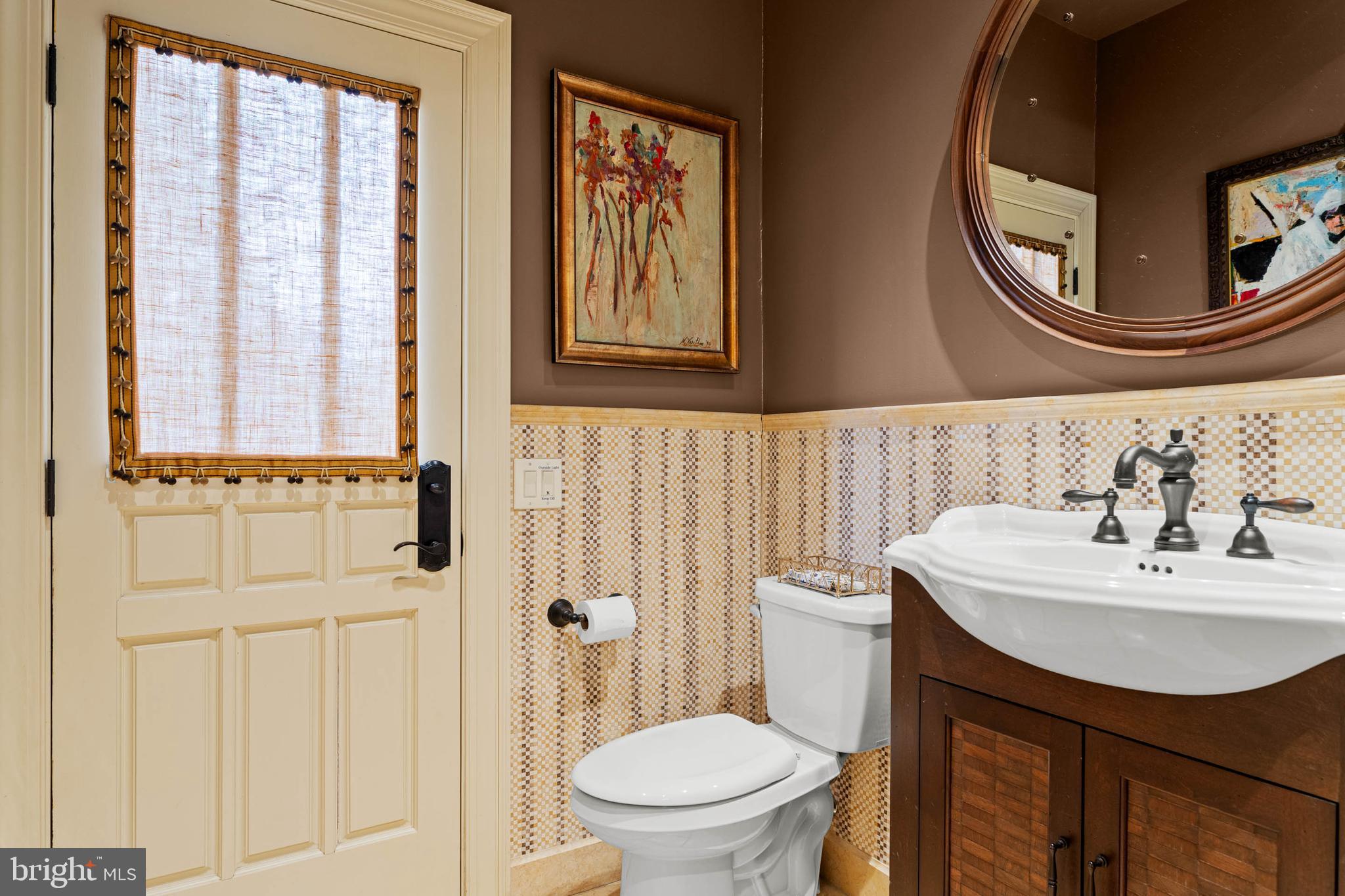 1347 Fording Brook Road Lower Gwynedd, PA 19002 - Photo 36 of 82 a bathroom with a sink a toilet and a mirror