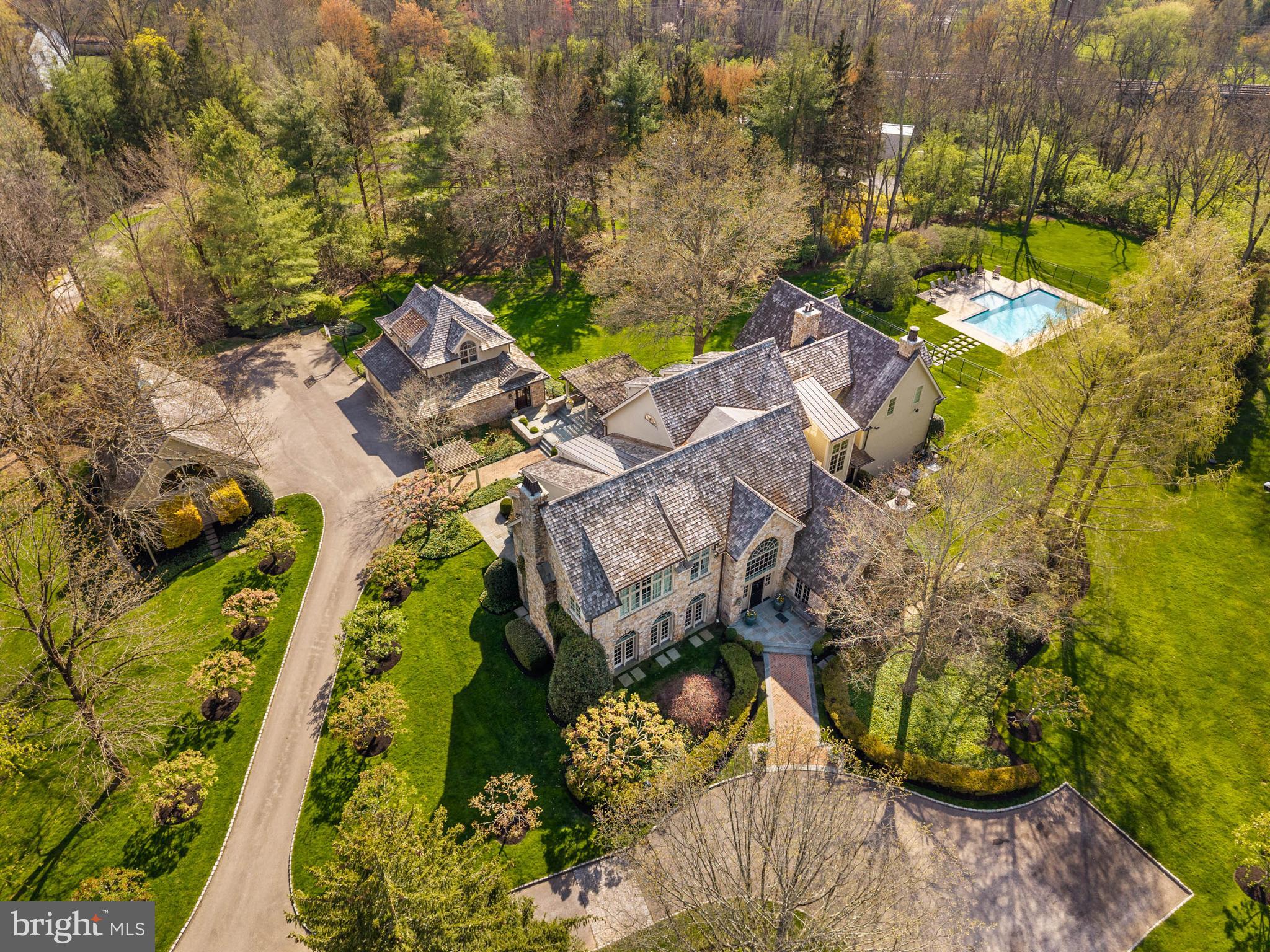 1347 Fording Brook Road Lower Gwynedd, PA 19002 - Photo 5 of 82 an aerial view of a house with a yard swimming pool and outdoor seating