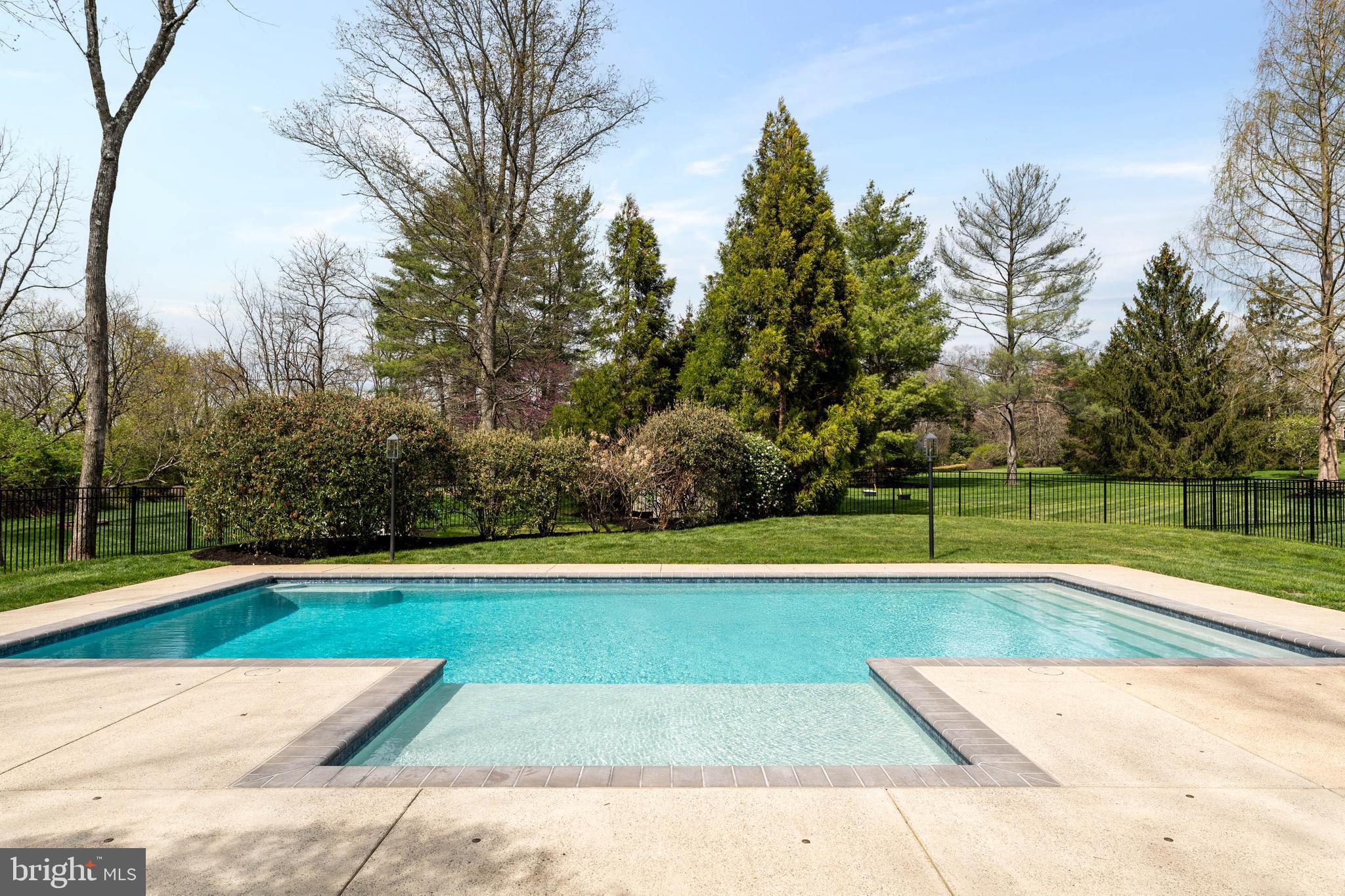 1347 Fording Brook Road Lower Gwynedd, PA 19002 - Photo 68 of 82 a view of a swimming pool with an outdoor space and seating area