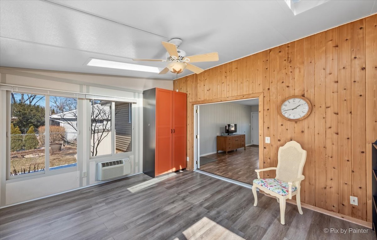 34 Johnathan Road Lake Zurich, IL 60047 - Photo 11 of 27 a dining room with wooden floor and a chandelier