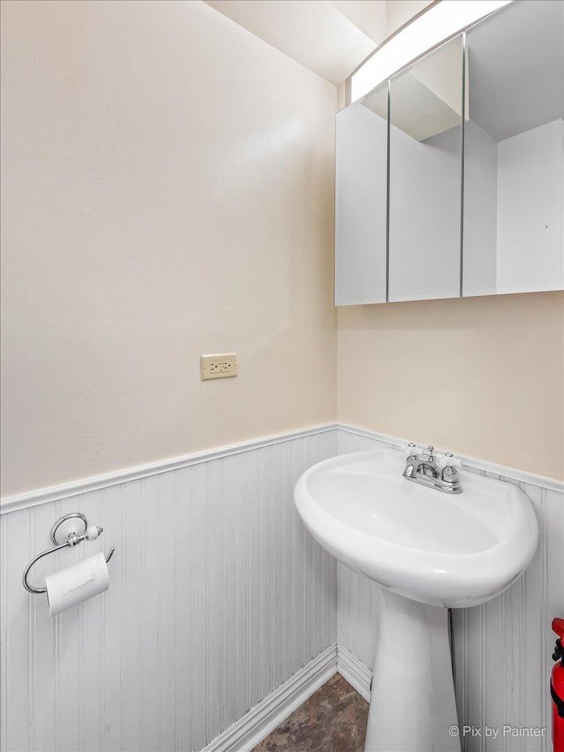 34 Johnathan Road Lake Zurich, IL 60047 - Photo 12 of 27 a bathroom with a sink and a mirror