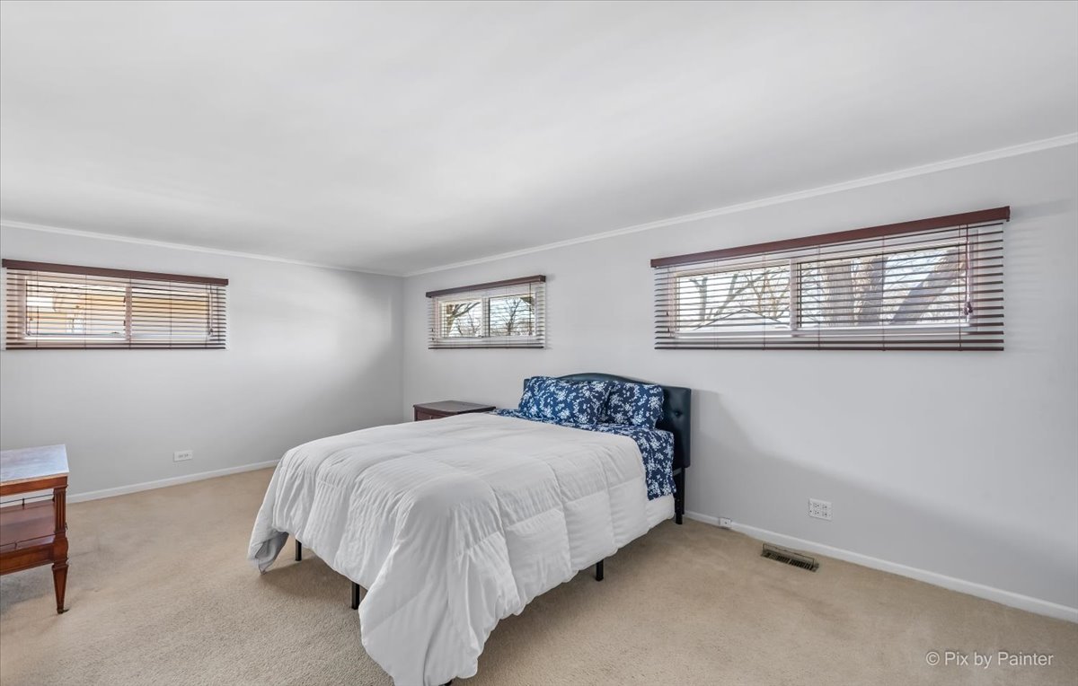 34 Johnathan Road Lake Zurich, IL 60047 - Photo 18 of 27 a bedroom with a bed and a window
