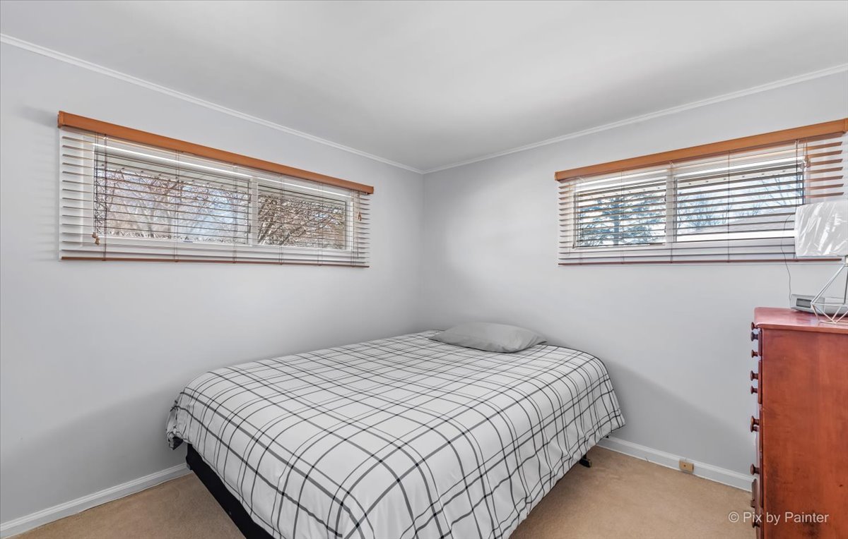 34 Johnathan Road Lake Zurich, IL 60047 - Photo 20 of 27 a bedroom with a bed and a window