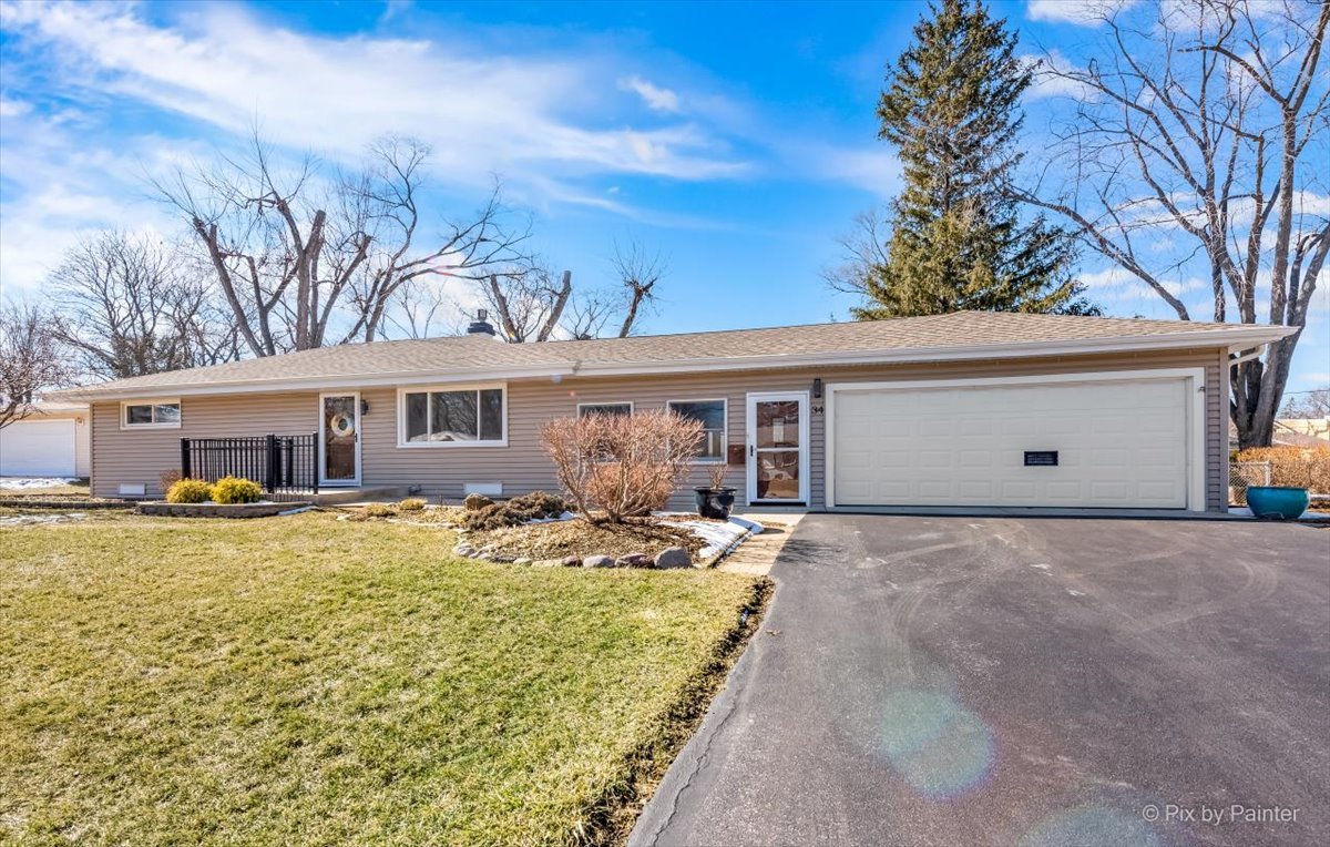 34 Johnathan Road Lake Zurich, IL 60047 - Photo 2 of 27 a front view of house with yard seating and green space