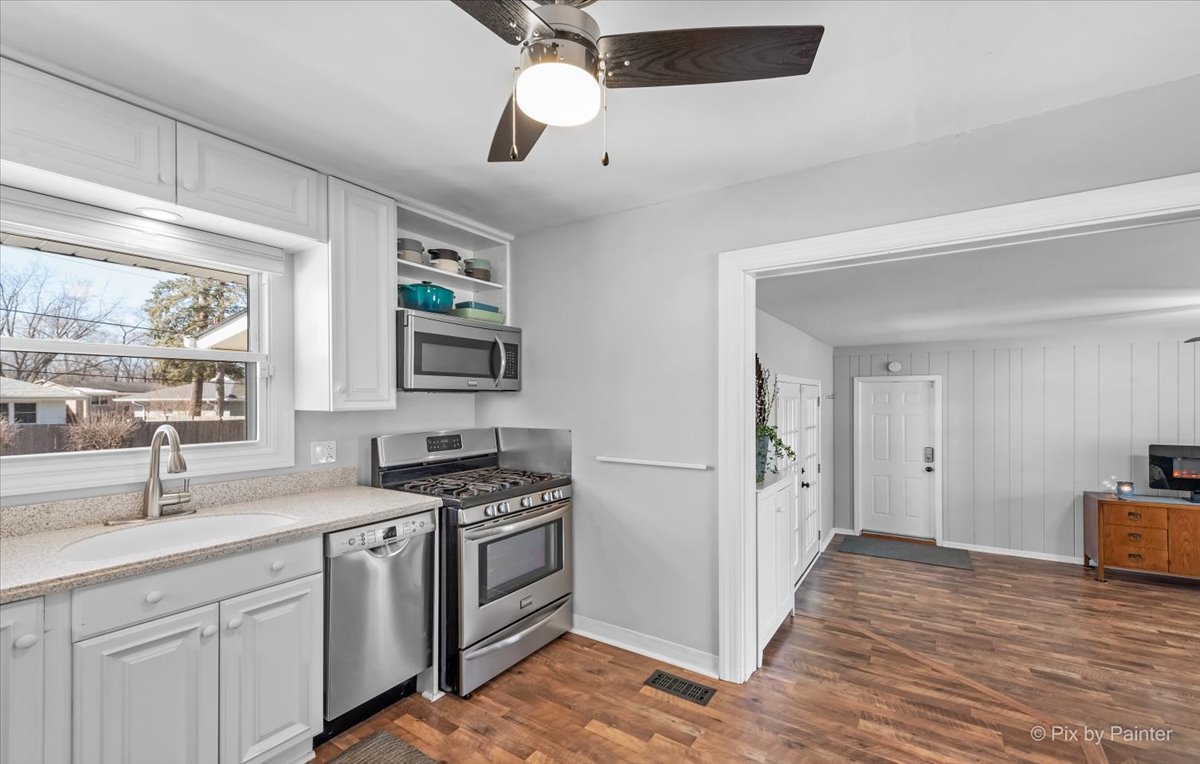 34 Johnathan Road Lake Zurich, IL 60047 - Photo 6 of 27 a kitchen with stainless steel appliances granite countertop a sink stove and refrigerator