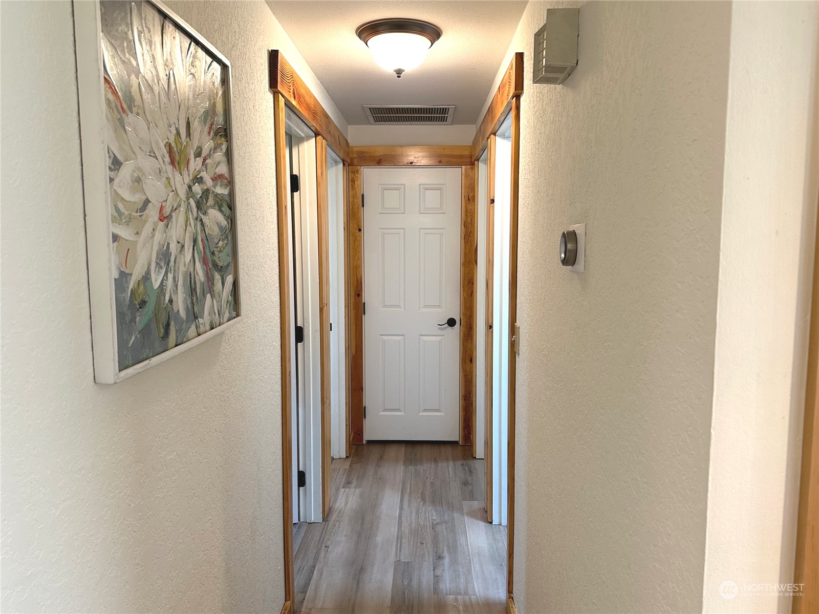 2814 Stafford Way Bothell, WA 98012 - Photo 24 of 38 a view of a hallway with wooden floor and closet
