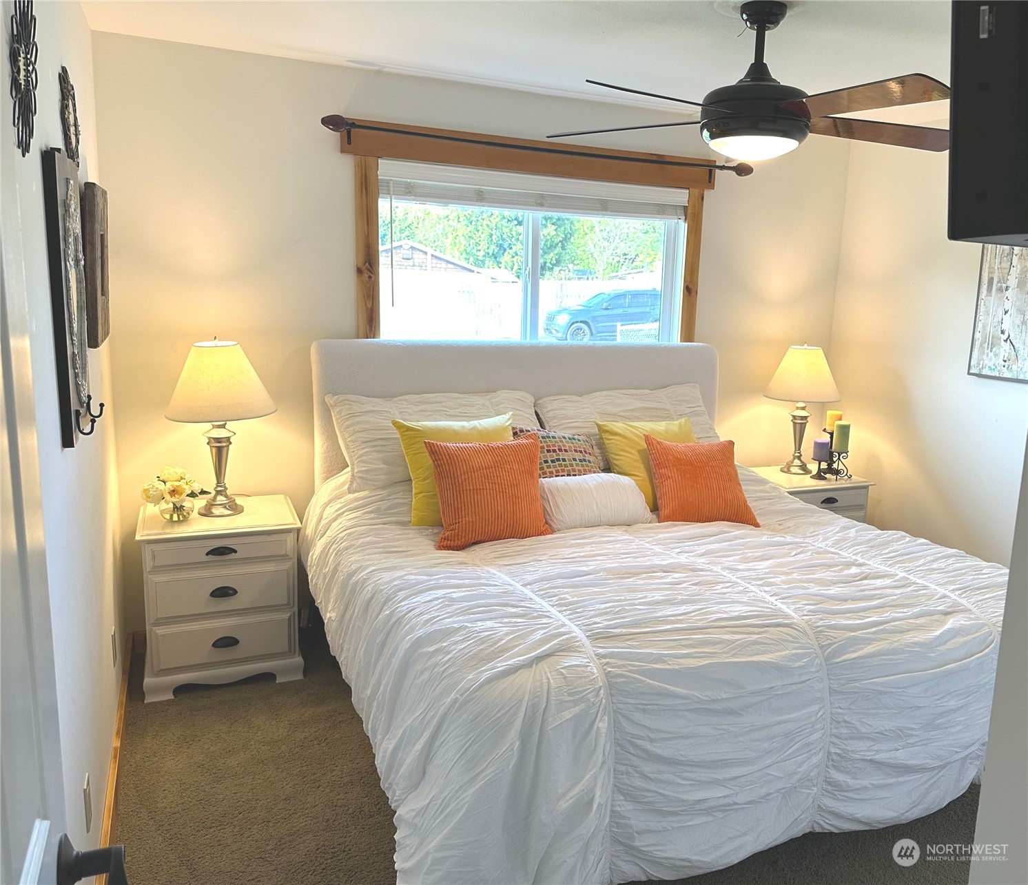 2814 Stafford Way Bothell, WA 98012 - Photo 25 of 38 a bedroom with a bed and a chandelier fan