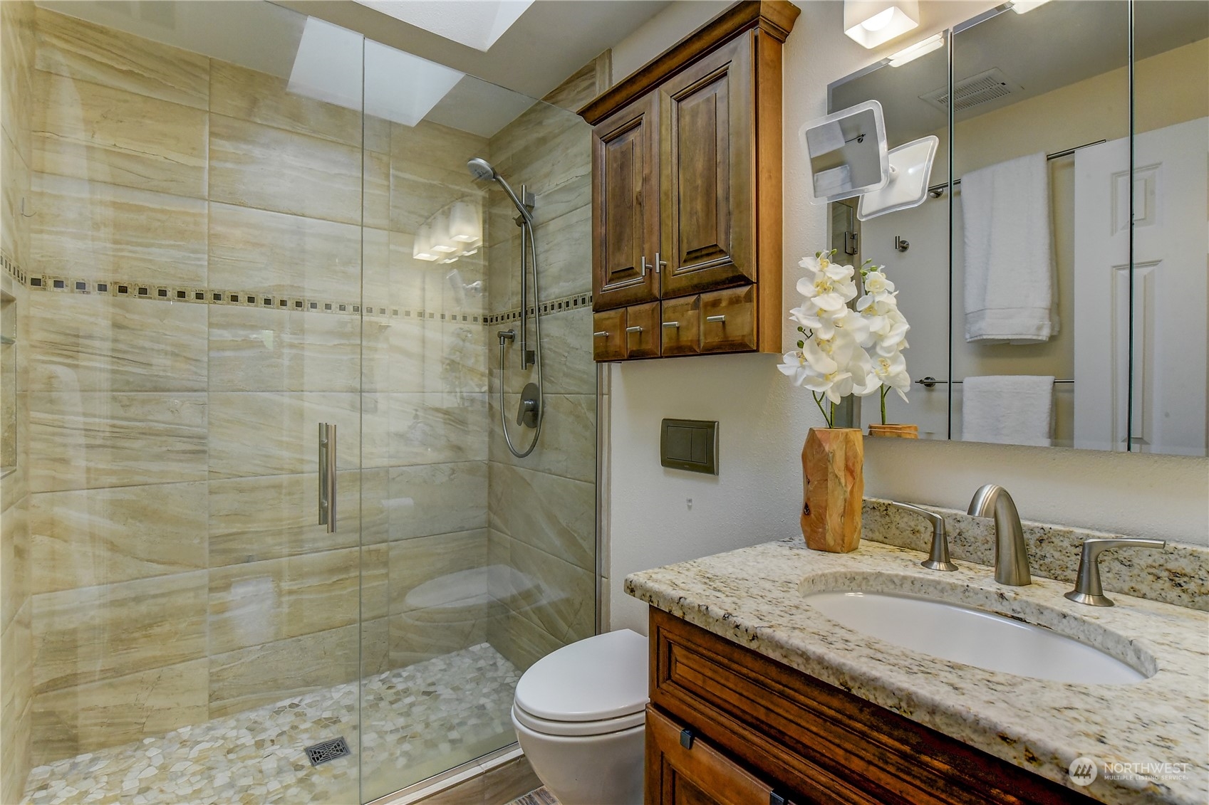 2814 Stafford Way Bothell, WA 98012 - Photo 29 of 38 a bathroom with a granite countertop sink a toilet and shower