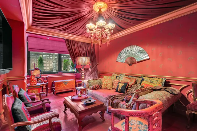 a view of a livingroom with furniture and a window