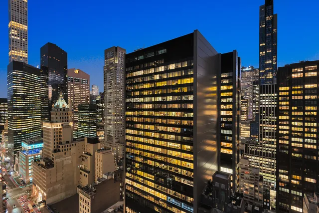 a view of a city with tall buildings in the background