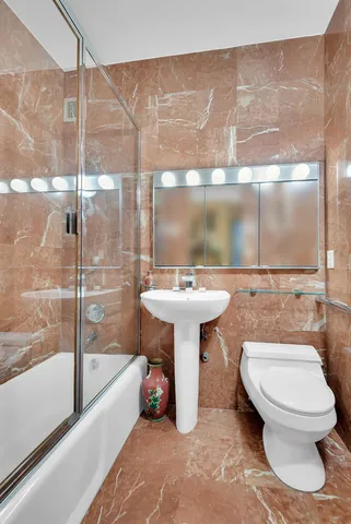 a bed room with a bed and a large window