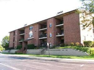 760 Weidner Road, Unit 102 Buffalo Grove, IL 60089 - Photo 3 of 3 a front view of a house with a yard