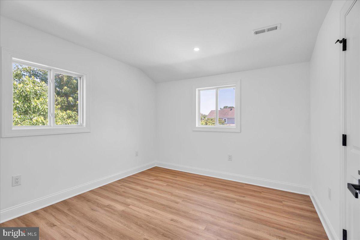 2504 Church Road Cinnaminson, NJ 08077 - Photo 42 of 79 a view of empty room with wooden floor and fan