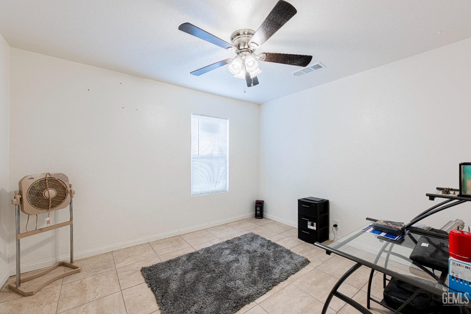 Undisclosed Address Bakersfield, CA 93307 - Photo 20 of 27 a view of a livingroom with a workspace