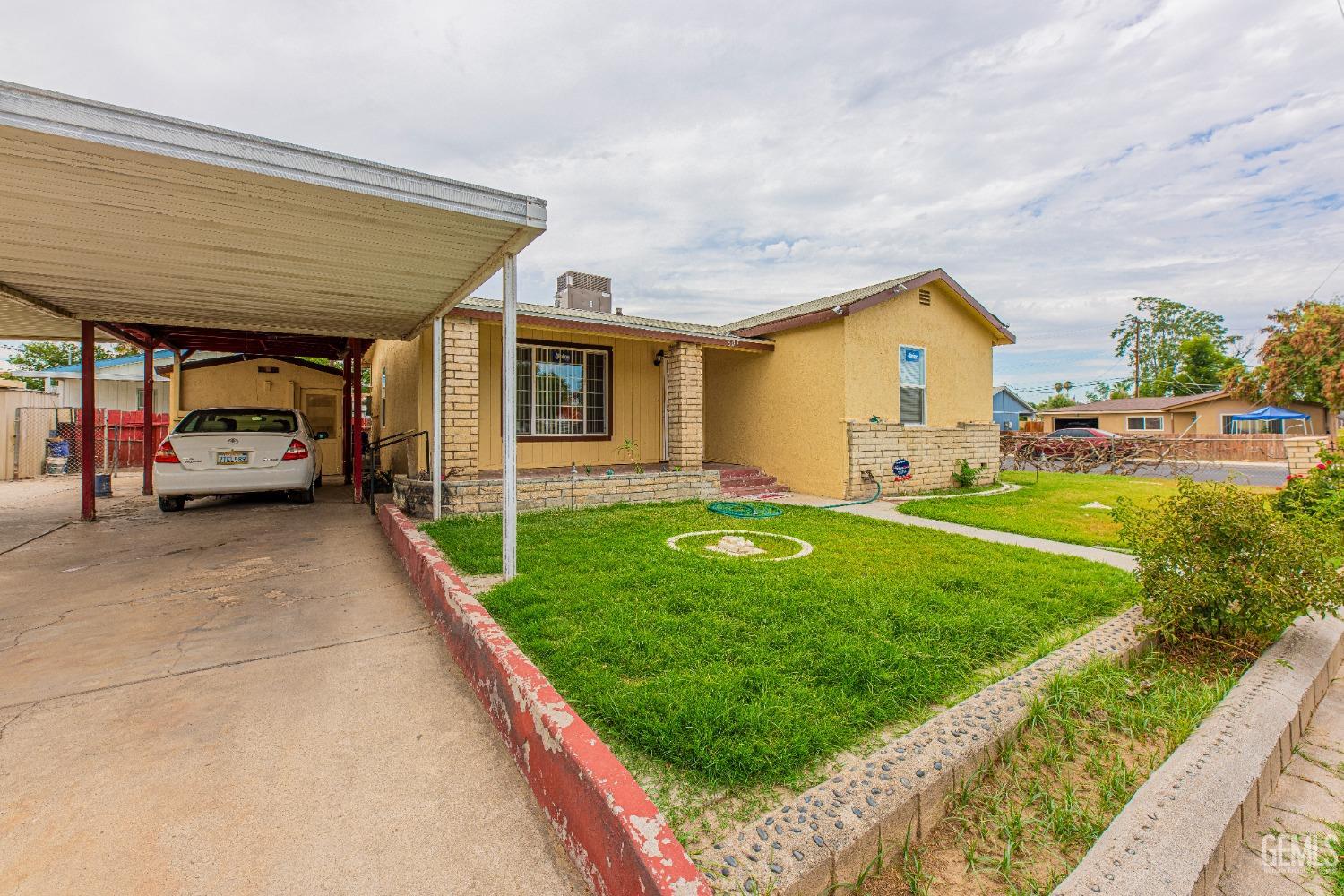 Undisclosed Address Bakersfield, CA 93307 - Photo 2 of 27 a view of outdoor space yard and porch