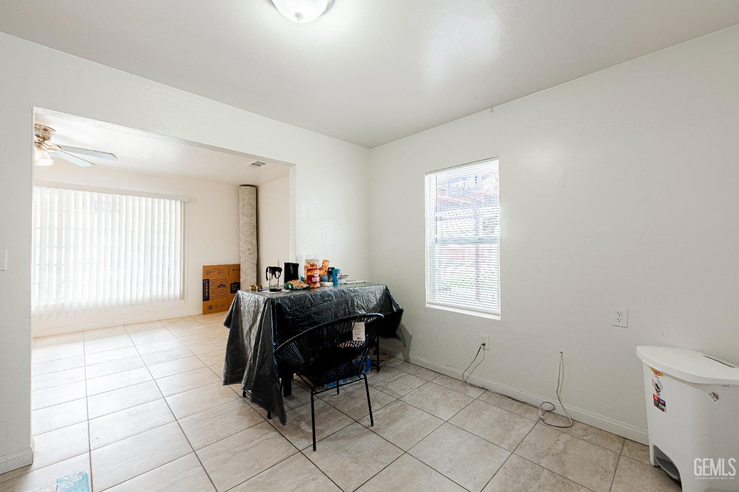 Undisclosed Address Bakersfield, CA 93307 - Photo 22 of 27 a living room with furniture and a window
