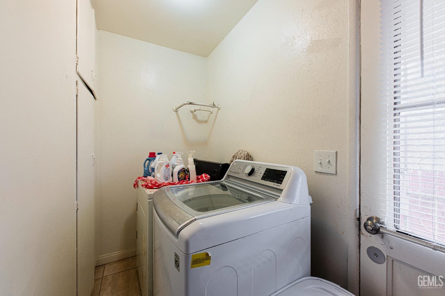 Undisclosed Address Bakersfield, CA 93307 - Photo 23 of 27 a utility room with dryer and washer