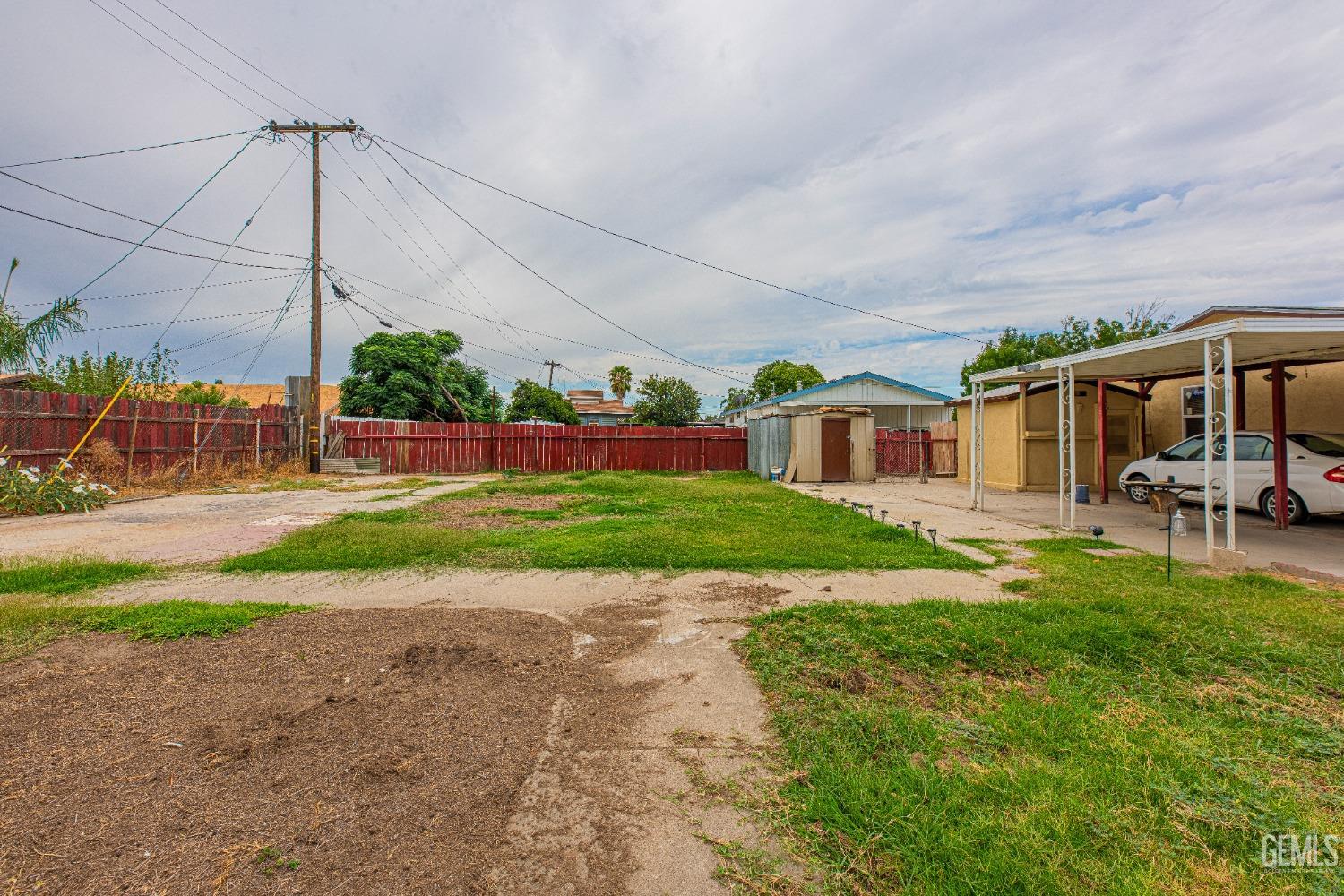 Undisclosed Address Bakersfield, CA 93307 - Photo 26 of 27 a view of a house with backyard and a slide