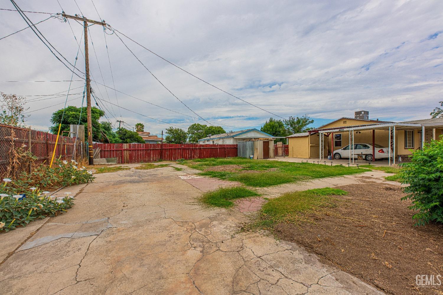 Undisclosed Address Bakersfield, CA 93307 - Photo 27 of 27 a view of a house with a yard