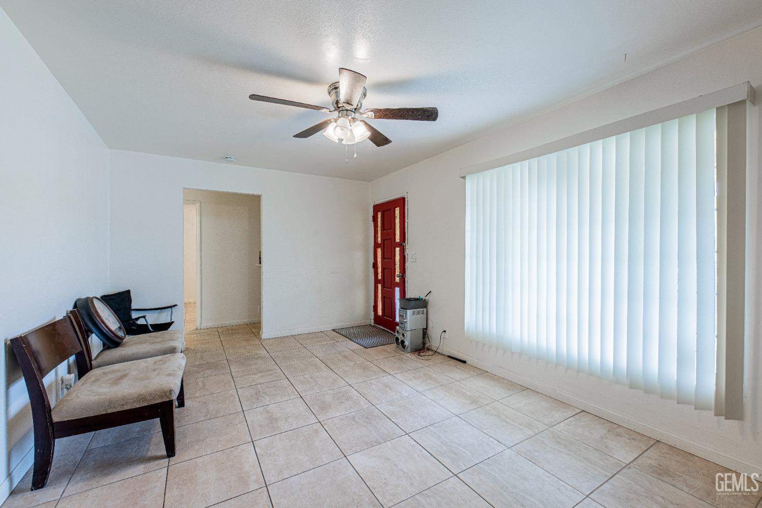 Undisclosed Address Bakersfield, CA 93307 - Photo 8 of 27 a view of room with workspace and a window