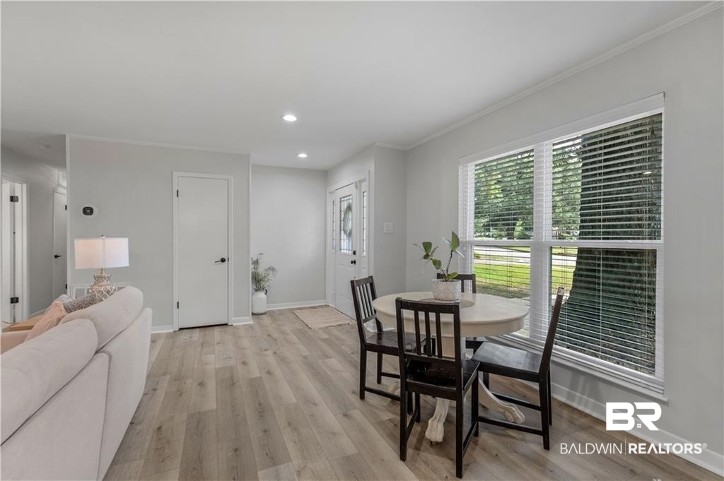 1624 Apex Drive Mobile, AL 36693 - Photo 7 of 29 Dining area featuring crown molding and light hardwood / wood-style flooring
