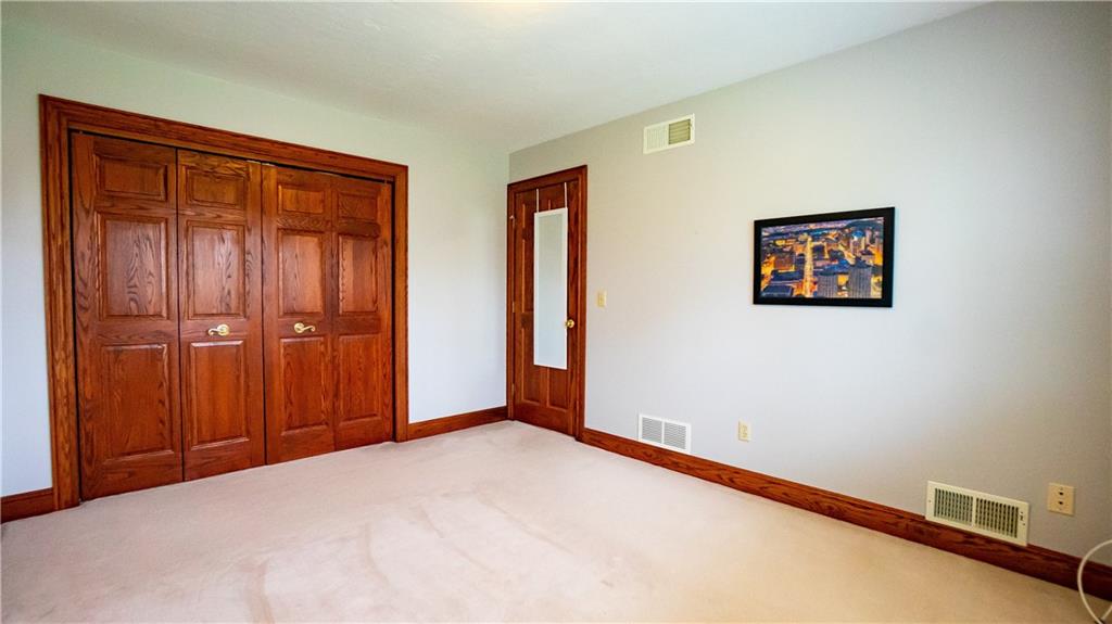 7034 Forrest Trail Road Butler, PA 16002 - Photo 13 of 25 a view of an empty room with wooden floor