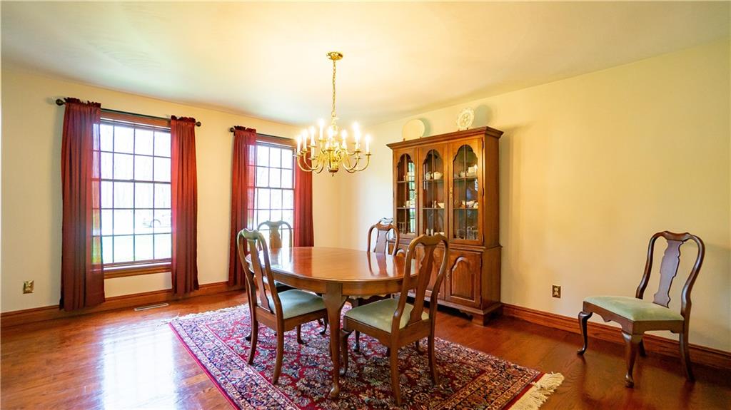 7034 Forrest Trail Road Butler, PA 16002 - Photo 3 of 25 a view of a dining room with furniture and wooden floor