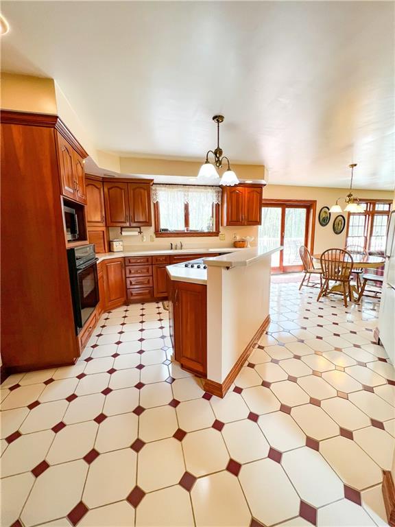 7034 Forrest Trail Road Butler, PA 16002 - Photo 5 of 25 a open kitchen with stainless steel appliances a stove a sink a counter top space and cabinets