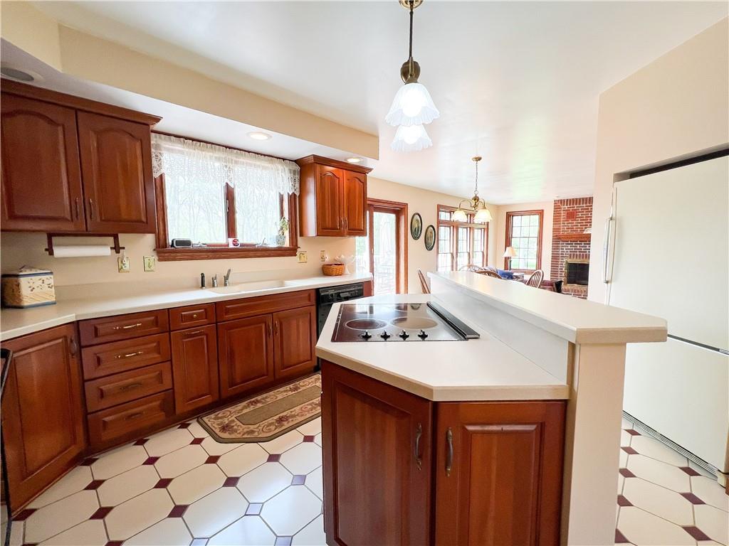 7034 Forrest Trail Road Butler, PA 16002 - Photo 6 of 25 a kitchen with a sink a stove and cabinets