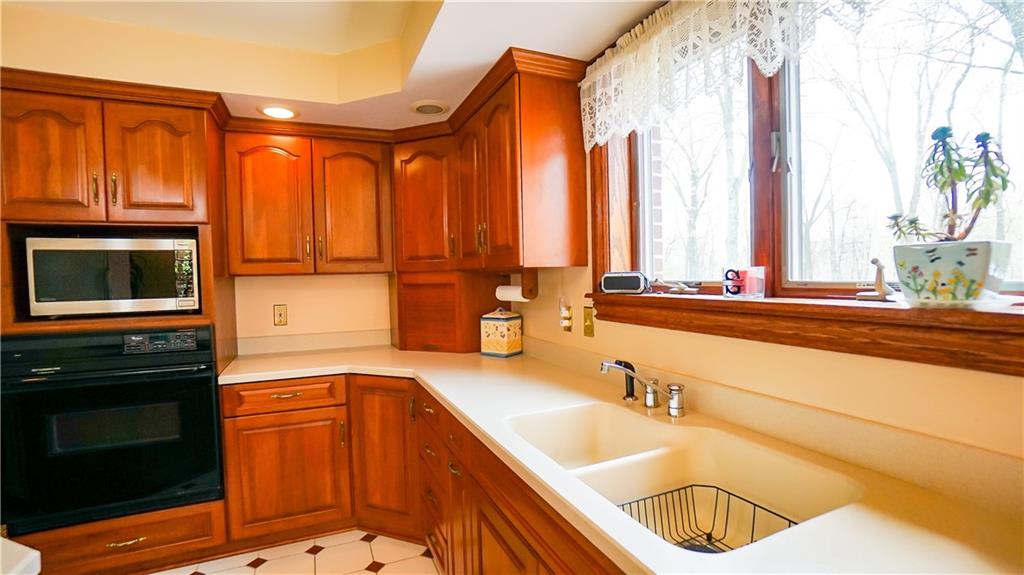 7034 Forrest Trail Road Butler, PA 16002 - Photo 7 of 25 a kitchen with a sink and a stove top oven