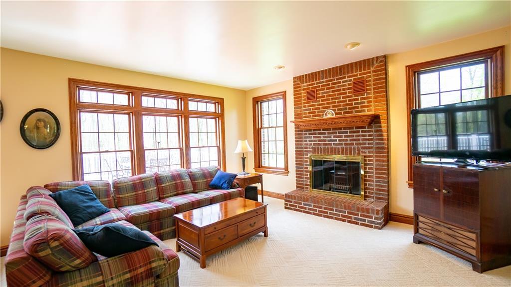 7034 Forrest Trail Road Butler, PA 16002 - Photo 10 of 25 a living room with furniture and a fireplace