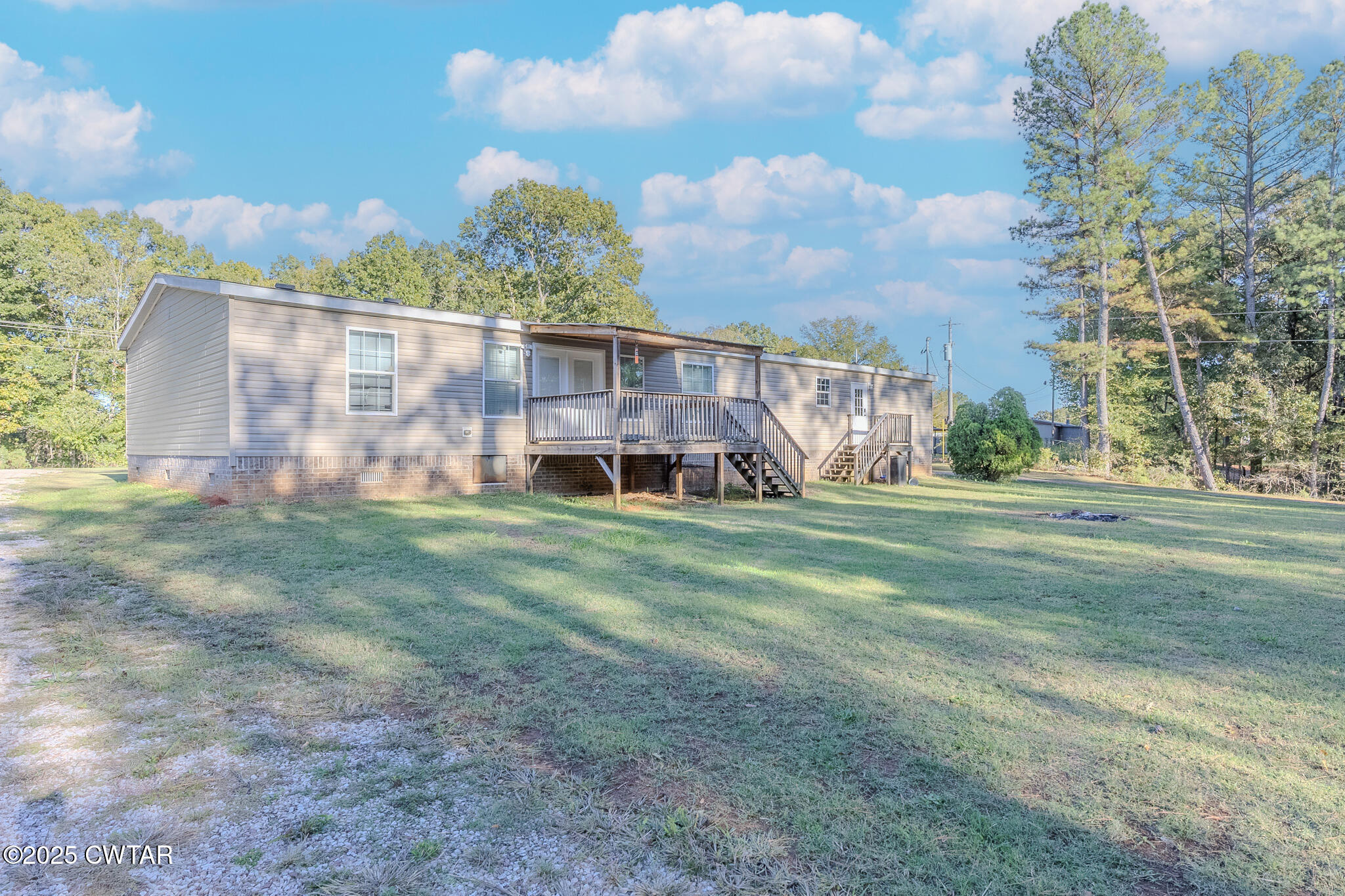 2785 Highway 138 Toone, TN 38381 - Photo 4 of 29 a front view of a house with a yard