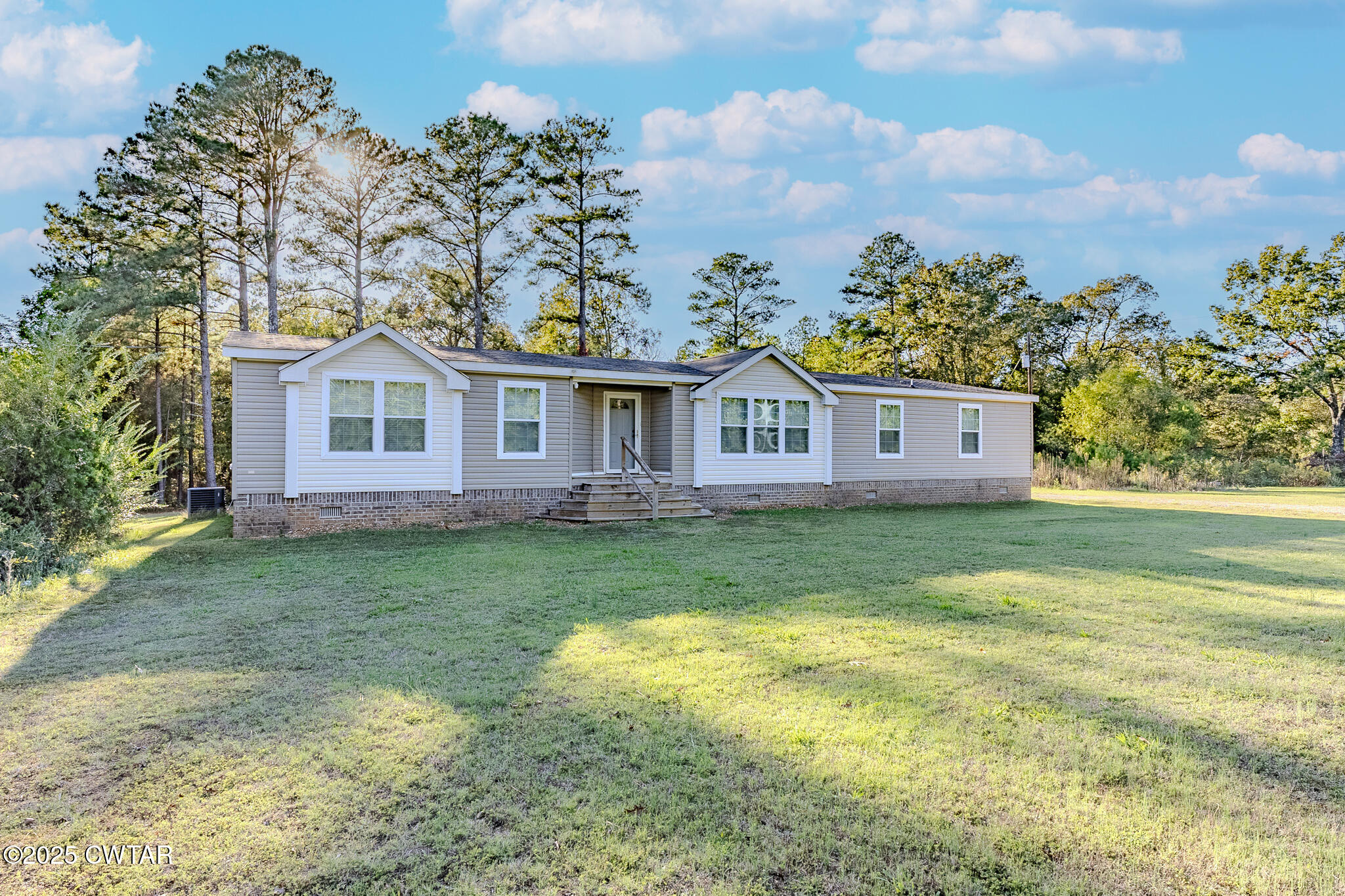 2785 Highway 138 Toone, TN 38381 - Photo 5 of 29 a view of a yard in front of a house with a fountain