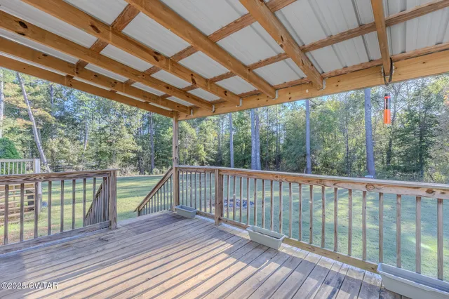 a view of outdoor space with deck and wooden floor