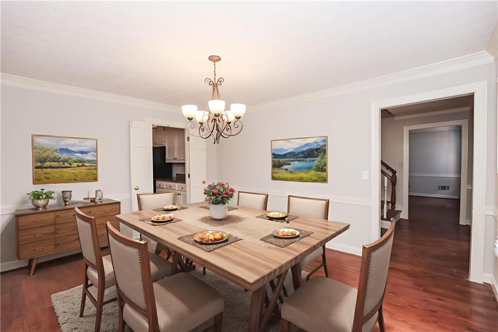 3122 Henderson Walk Atlanta, GA 30340 - Photo 11 of 70 a view of a dining room with furniture wooden floor and chandelier