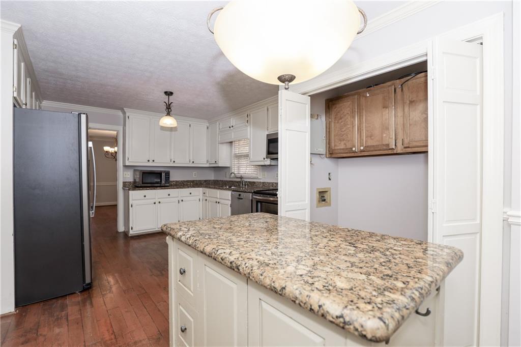 3122 Henderson Walk Atlanta, GA 30340 - Photo 19 of 70 a kitchen with stainless steel appliances granite countertop a refrigerator and a stove top oven