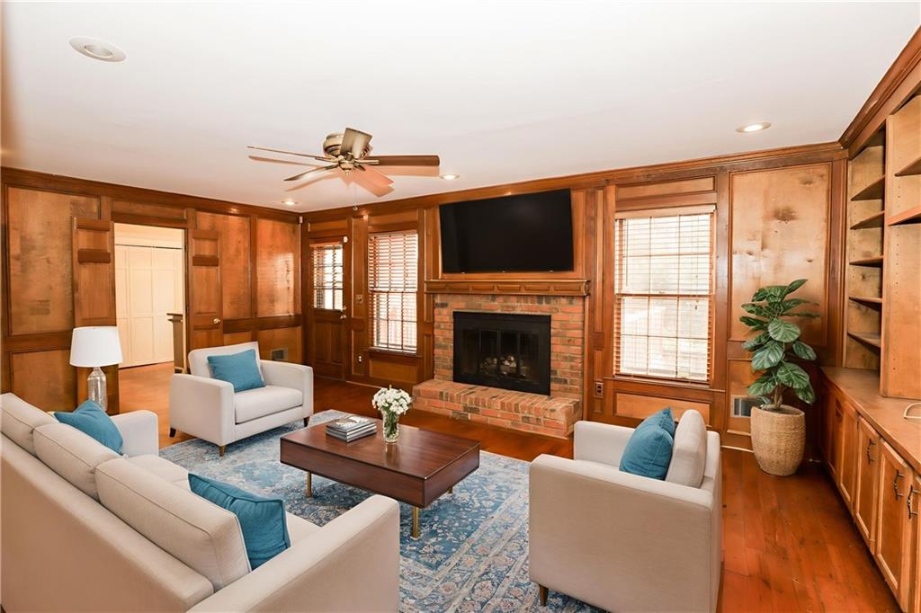 3122 Henderson Walk Atlanta, GA 30340 - Photo 21 of 70 a living room with furniture a fireplace and a flat screen tv