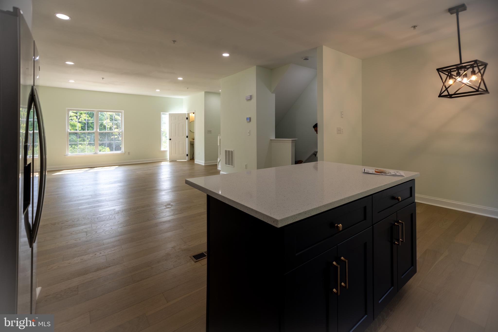 11904 White Heather Road Cockeysville, MD 21030 - Photo 11 of 42 a kitchen with a sink cabinets and wooden floor