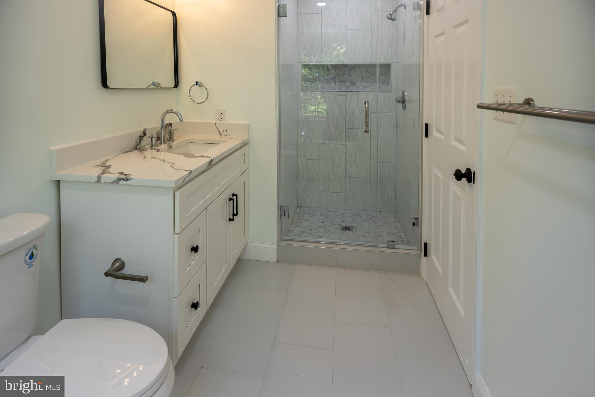 11904 White Heather Road Cockeysville, MD 21030 - Photo 18 of 42 a bathroom with a sink a toilet and shower