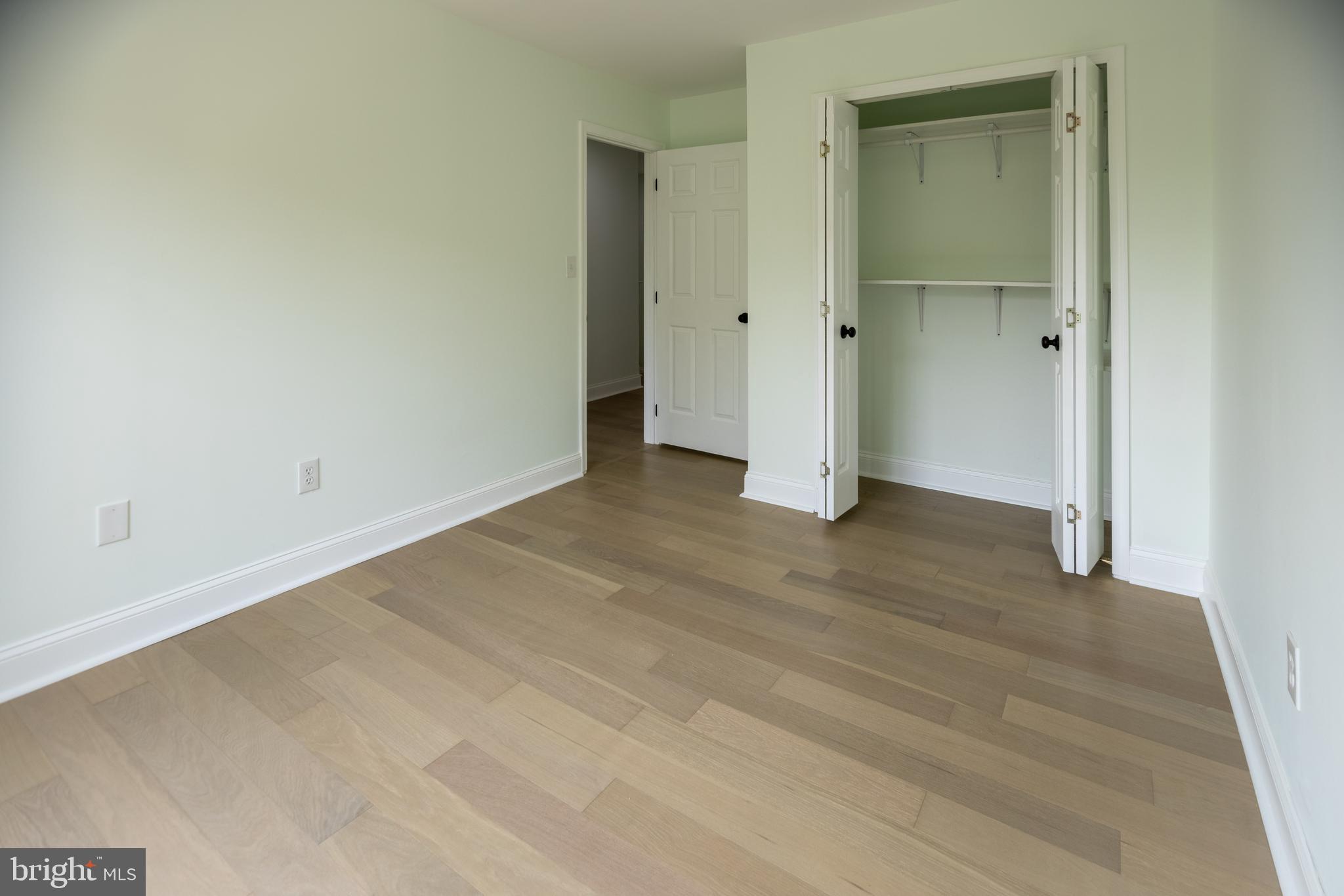 11904 White Heather Road Cockeysville, MD 21030 - Photo 27 of 42 an empty room with wooden door