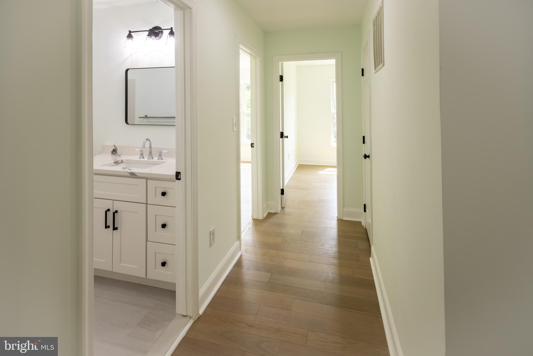 11904 White Heather Road Cockeysville, MD 21030 - Photo 31 of 42 a view of a bathroom from the hallway