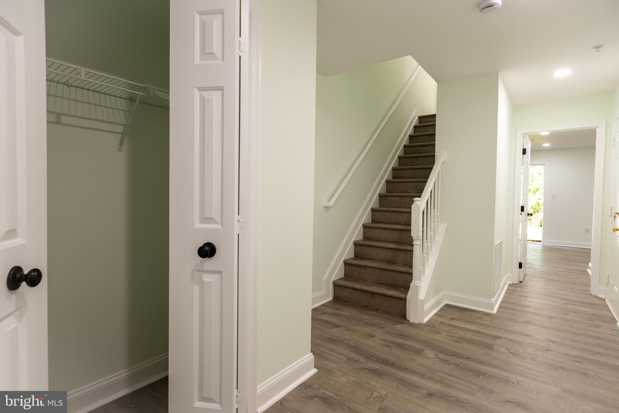 11904 White Heather Road Cockeysville, MD 21030 - Photo 34 of 42 a view of a hallway with wooden floor and entryway